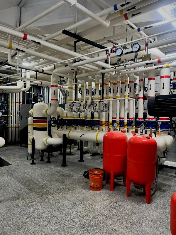 Expansion tanks and low loss header assembly in an HVAC plant room by Rasoul Hariri